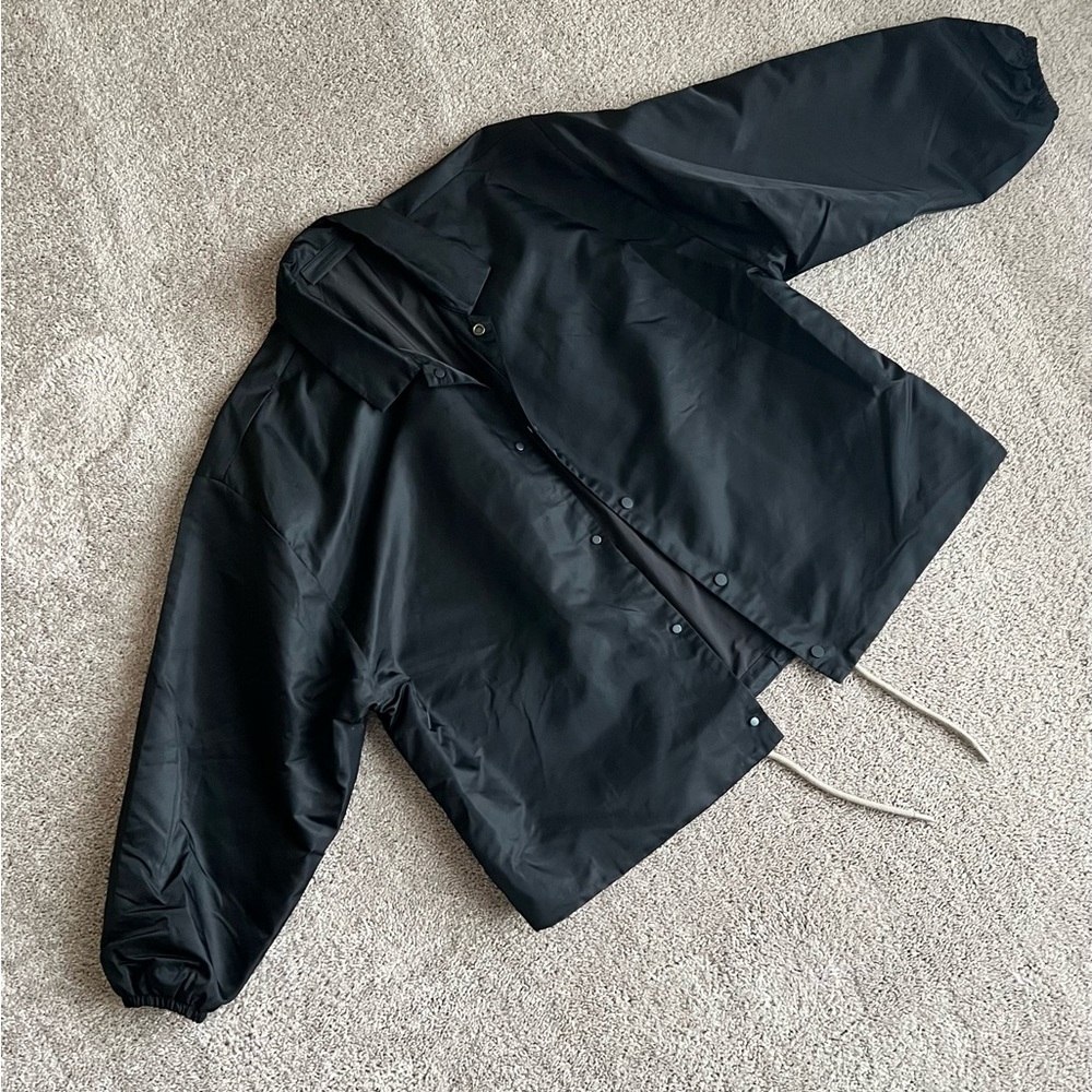 FEAR OF GOD ESSENTIALS
Logo-Appliquéd Shell Coach Jacket